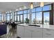 Bright kitchen features large windows with views, sleek cabinetry, and barstool seating at 122 N Harrington St # 1555, Raleigh, NC 27603