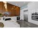 Modern kitchen features stainless steel appliances and sleek white cabinetry at 122 N Harrington St # 1555, Raleigh, NC 27603