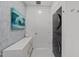 Efficient laundry room with a modern washer/dryer unit, ample storage, and contemporary design at 122 N Harrington St # 1555, Raleigh, NC 27603