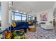 Bright living room featuring floor to ceiling windows and open floor plan at 122 N Harrington St # 1555, Raleigh, NC 27603
