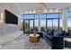 Bright, modern living room features floor-to-ceiling windows, stylish furnishings, and a spacious open layout at 122 N Harrington St # 1555, Raleigh, NC 27603