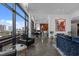 Modern living room with city view, floor-to-ceiling windows, telescope, and elegant seating at 122 N Harrington St # 1555, Raleigh, NC 27603