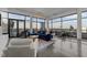 Bright, modern living room features floor-to-ceiling windows, stylish furnishings, and a spacious open layout at 122 N Harrington St # 1555, Raleigh, NC 27603