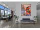 Modern living room with open floor plan, art piece, and large windows with plenty of natural light at 122 N Harrington St # 1555, Raleigh, NC 27603