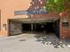 Parking garage entrance with gated access and brick architecture details, ensuring safety and convenience at 122 N Harrington St # 1555, Raleigh, NC 27603