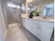 Elegant bathroom with a glass-enclosed shower, double vanity, and large mirror for a luxurious feel at 124 Sugar Run Dr # 11, Fuquay Varina, NC 27526