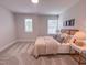Cozy bedroom with neutral tones, carpet, and two windows for ample natural light at 124 Sugar Run Dr # 11, Fuquay Varina, NC 27526
