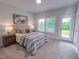 Comfortable bedroom with neutral decor, a plush bed, and an ensuite bathroom at 124 Sugar Run Dr # 11, Fuquay Varina, NC 27526