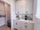 Convenient butler's pantry with extra storage, sink, and countertop space to help with kitchen organization at 124 Sugar Run Dr # 11, Fuquay Varina, NC 27526