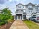 Attractive gray townhome with a two-story elevation and a well-manicured front yard at 124 Sugar Run Dr # 11, Fuquay Varina, NC 27526