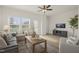 Comfortable living room featuring modern decor, hardwood floors, and access to an outdoor deck at 124 Sugar Run Dr # 11, Fuquay Varina, NC 27526