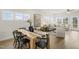 Open-concept living and dining area filled with natural light, featuring modern furnishings and hardwood floors at 124 Sugar Run Dr # 11, Fuquay Varina, NC 27526