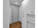 Clean entryway featuring light gray walls, stained concrete floor, and white cabinets at 1300 St Marys St # 402, Raleigh, NC 27605