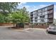 Contemporary building featuring visitor parking and manicured landscaping at 1300 St Marys St # 402, Raleigh, NC 27605