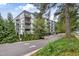 Contemporary condo building with balconies and parking with a beautiful tree canopy at 1300 St Marys St # 402, Raleigh, NC 27605