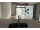 Open kitchen with modern cabinets, sink, sliding doors and natural light at 1300 St Marys St # 402, Raleigh, NC 27605