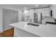 Modern kitchen with a large island, quartz countertops, and stainless steel appliances at 1300 St Marys St # 402, Raleigh, NC 27605