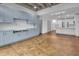 Open living area showcases built-in cabinets and seamlessly connects to a modern, white kitchen at 1300 St Marys St # 402, Raleigh, NC 27605