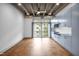Spacious living area has an exposed ceiling, light blue built-in cabinets and large windows at 1300 St Marys St # 402, Raleigh, NC 27605