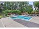 Inviting community pool area with comfortable lounge chairs and outdoor grilling stations at 1300 St Marys St # 402, Raleigh, NC 27605