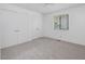 Bedroom with neutral carpet, two closets, and a window at 152 A&B Cedar Terrace, Chapel Hill, NC 27516