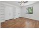 Bedroom featuring hardwood floors, a ceiling fan, and two closets at 152 A&B Cedar Terrace, Chapel Hill, NC 27516