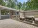 Exterior deck with built in seating, an attached table, and views of surrounding woods at 152 A&B Cedar Terrace, Chapel Hill, NC 27516