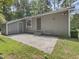 Photo shows the exterior of the home with an entry door and concrete patio at 152 A&B Cedar Terrace, Chapel Hill, NC 27516
