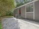Charming home entrance with gray siding, red door, and concrete parking at 152 A&B Cedar Terrace, Chapel Hill, NC 27516
