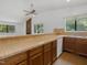 Kitchen featuring wood cabinets, laminate counters, and opening into the living room at 152 A&B Cedar Terrace, Chapel Hill, NC 27516