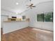 Bright kitchen area with white cabinets, ceiling fan, and natural light at 152 A&B Cedar Terrace, Chapel Hill, NC 27516