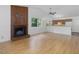 Open floor plan living room with wood floors, fireplace, and adjacent kitchen at 152 A&B Cedar Terrace, Chapel Hill, NC 27516