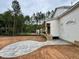 View of a backyard with stone paver patio and trees surrounding the property at 155 Cherry Bark Dr, Youngsville, NC 27596