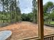 View of a secluded backyard showing trees surrounding the perimeter of the property at 155 Cherry Bark Dr, Youngsville, NC 27596
