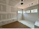 Bathroom under construction with tiled shower and mosaic tile flooring at 155 Cherry Bark Dr, Youngsville, NC 27596