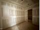 Bedroom in progress with newly installed drywall and a doorway to an adjourning room at 155 Cherry Bark Dr, Youngsville, NC 27596
