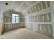View of a bedroom showing framing with drywall in progress and a window at 155 Cherry Bark Dr, Youngsville, NC 27596