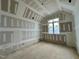 Slanted ceiling bedroom in progress with newly installed drywall, recessed lighting, and natural light at 155 Cherry Bark Dr, Youngsville, NC 27596