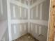 Unfinished walk-in closet with plumbing and wiring in progress at 155 Cherry Bark Dr, Youngsville, NC 27596