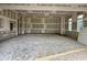 Expansive garage space with unfinished walls, offering potential for customization at 155 Cherry Bark Dr, Youngsville, NC 27596