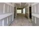 View of a hallway in progress, with a glimpse of the exterior and unfinished walls at 155 Cherry Bark Dr, Youngsville, NC 27596