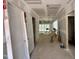 Spacious hallway with unfinished walls leads to the rest of the under-construction house at 155 Cherry Bark Dr, Youngsville, NC 27596
