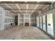 Spacious living room featuring a fireplace, sliding glass doors, and rough-in wiring at 155 Cherry Bark Dr, Youngsville, NC 27596
