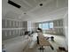A large room shows drywall, windows, and construction equipment at 155 Cherry Bark Dr, Youngsville, NC 27596