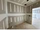 View of a room showing framing with drywall in progress and exposed flooring at 155 Cherry Bark Dr, Youngsville, NC 27596
