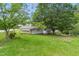 Backyard shot of shed and a one-story home at 16 S Church, Coats, NC 27521