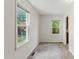 Cozy bedroom with two windows providing ample natural light and vinyl floors at 16 S Church, Coats, NC 27521