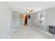 Gray bedroom with built-in shelving, windows, ceiling fan, and climate control at 16 S Church, Coats, NC 27521