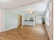 Bright living room with open floorplan, hardwood floors, and abundant natural light at 16 S Church, Coats, NC 27521