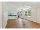 Bright living room with open floorplan, hardwood floors, and abundant natural light at 16 S Church, Coats, NC 27521